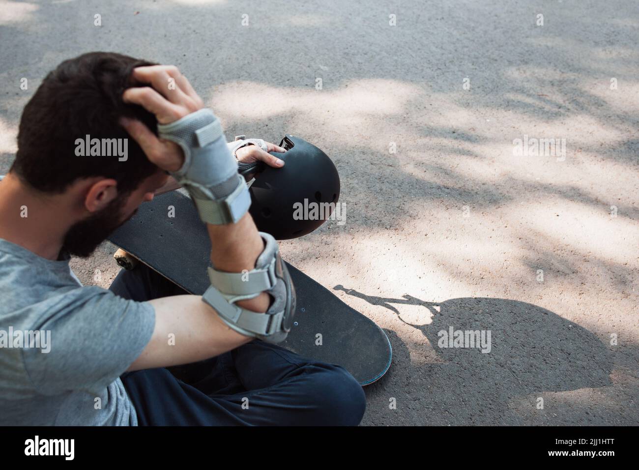 Extreme sport painful injury. Head trauma accident Stock Photo