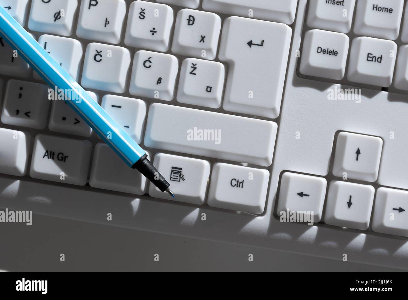 Important Messages Written On Keyboard Buttons With Pen Placed Between Them. Crutial Informations Presented On Pc Keys. Critical Announcemets Stock Photo