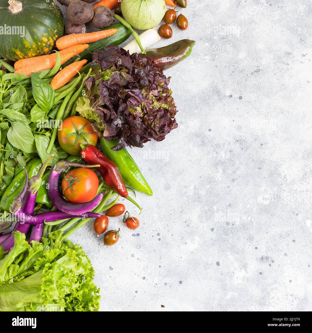 Different vegetables on cement background. Healthy eating concept. Top view. Stock Photo