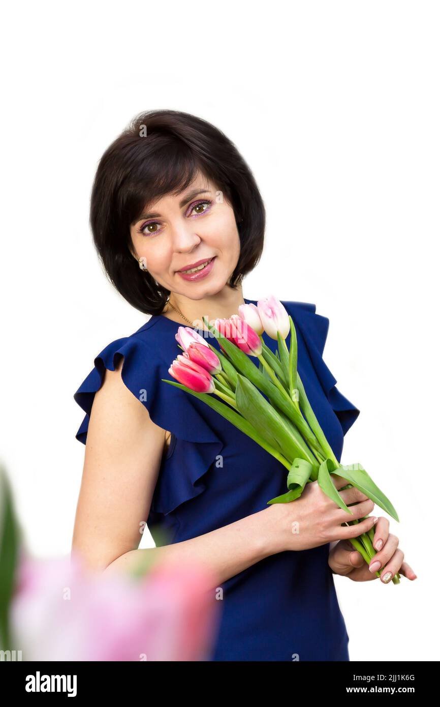 A young mother received flowers gift for her birthday. Isolated, white