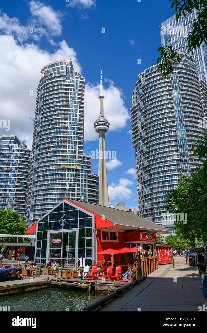 Toronto taxi boat and sightseeing tours harbour with BeaverTails café and CN Tower in the background, The Waterfront, Toronto, Ontario, Canada. Stock Photo