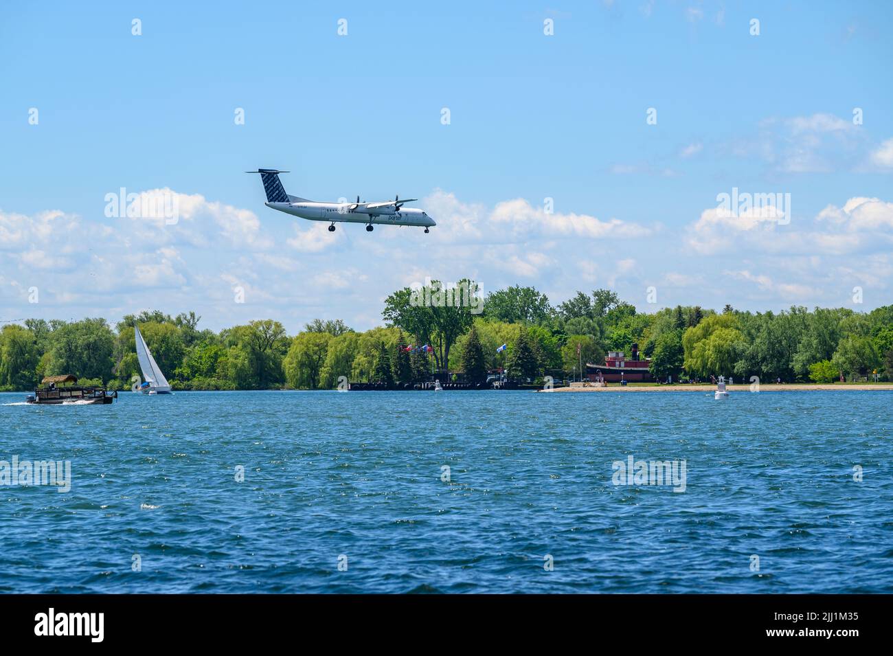 Porter Airlines Bombardier Dash 8-Q400 approaching Billy Bishop Toronto City Airport for landing, Ontario, Canada. Stock Photo