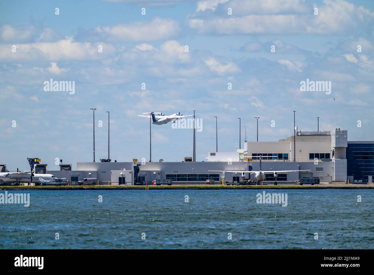 A Porter Airlines Bombardier Dash 8 Q-400 taking off from Billy Bishop Toronto City Airport, Ontario, Canada. Stock Photo