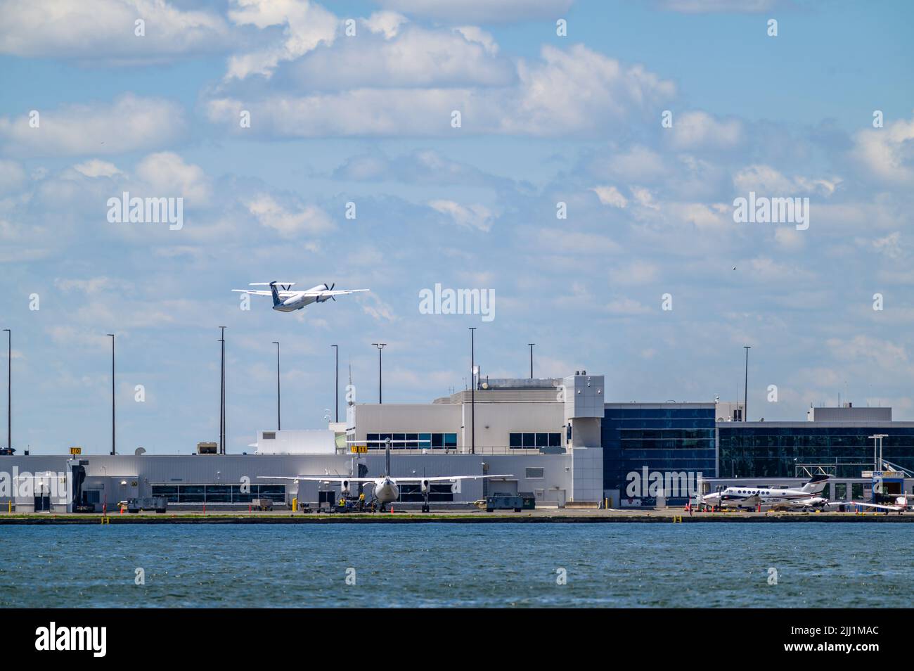 A Porter Airlines Bombardier Dash 8 Q-400 taking off from Billy Bishop Toronto City Airport, Ontario, Canada. Stock Photo