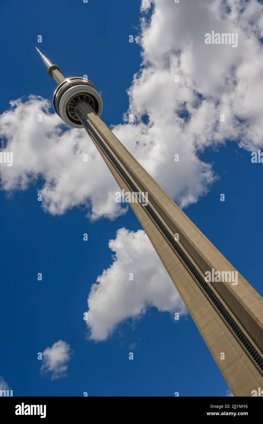 Looking up at the impressive CN Tower from ground level near Rogers Centre, Toronto, Ontario, Canada. Stock Photo