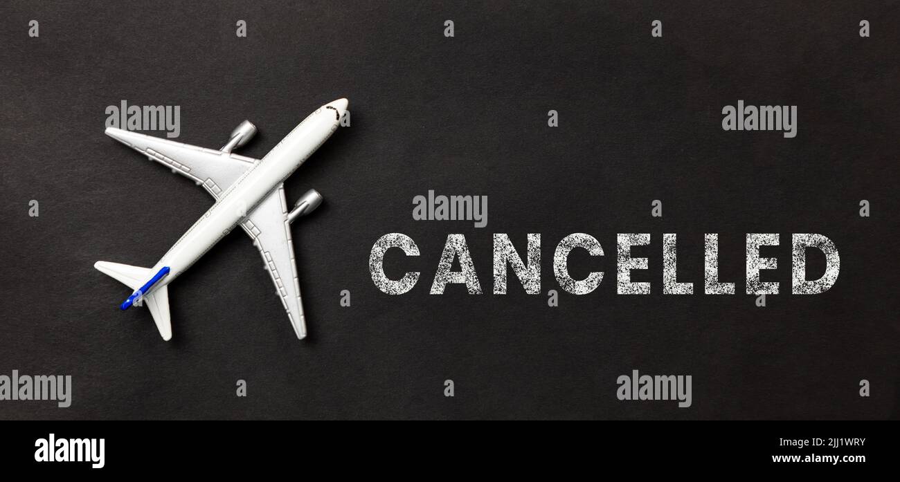A White Plane Flight On A Black Background With Text cancelled Stock a-white-plane-flight-on-a-black-background-with-text-cancelled-stock