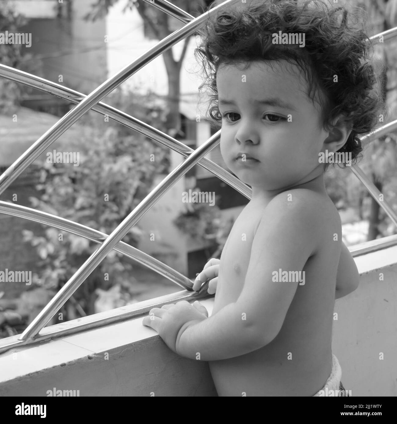 Cute little boy Shivaay at home balcony during summer time, Sweet little boy photoshoot during day light, Little boy enjoying at home during photo sho Stock Photo