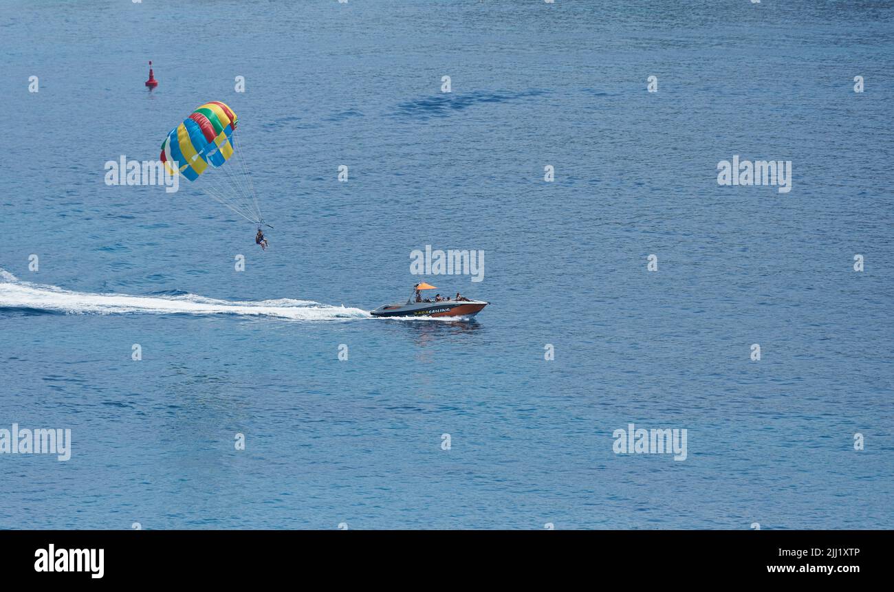 Boat with a parachute for parasailing tourists in the sea Stock Photo