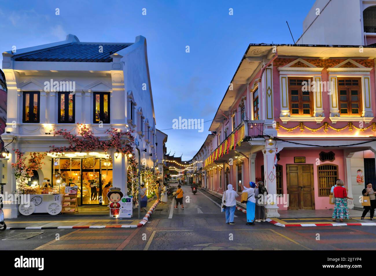 Dusk falls over the picturesque Sino-Portuguese or Peranakan shophouses in Thalang Road in the Old Town heritage area of Phuket Town, Phuket, Thailand Stock Photo