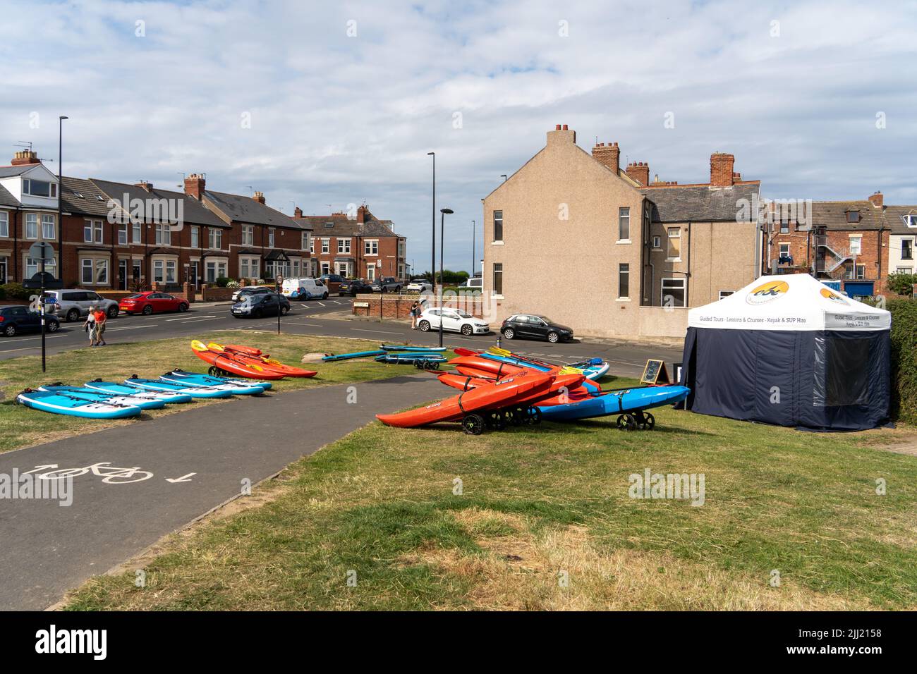 Stand Up Paddleboards and Kayaks for hire in the village of Cullercoats, North Tyneside, UK Stock Photo