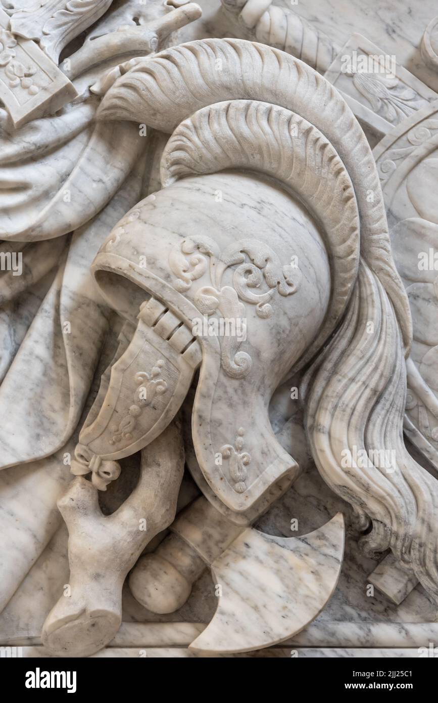 Detail of ancient roman helmet carved on decorative marble wall Stock Photo