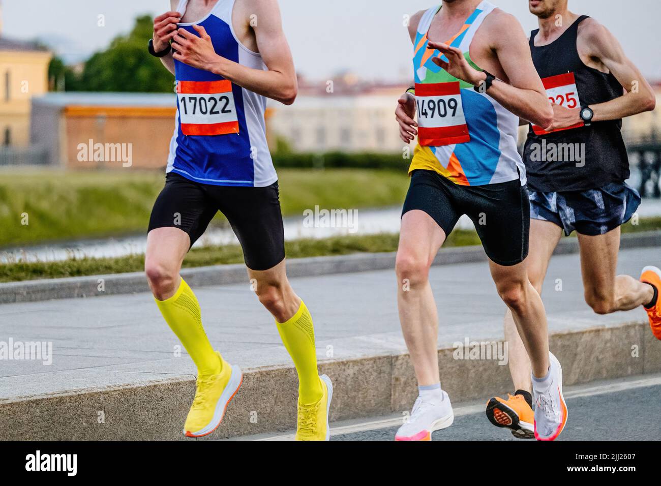 group of male runners run marathon race Stock Photo Alamy