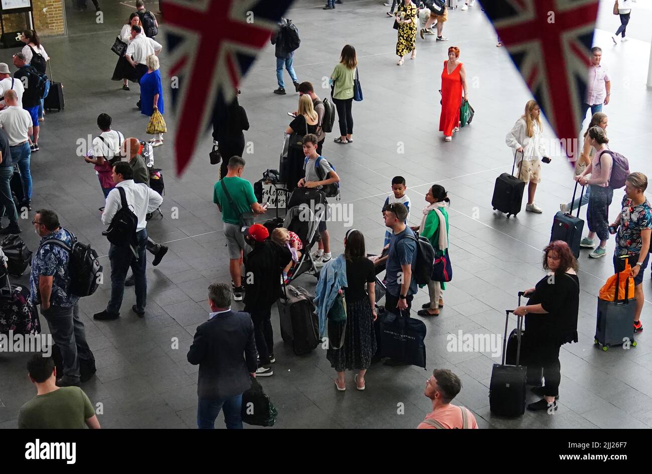 People at King's Cross railway station in London as many families embark on getaways at the start of summer holidays for many schools in England and Wales. Picture date: Friday July 22, 2022. Stock Photo