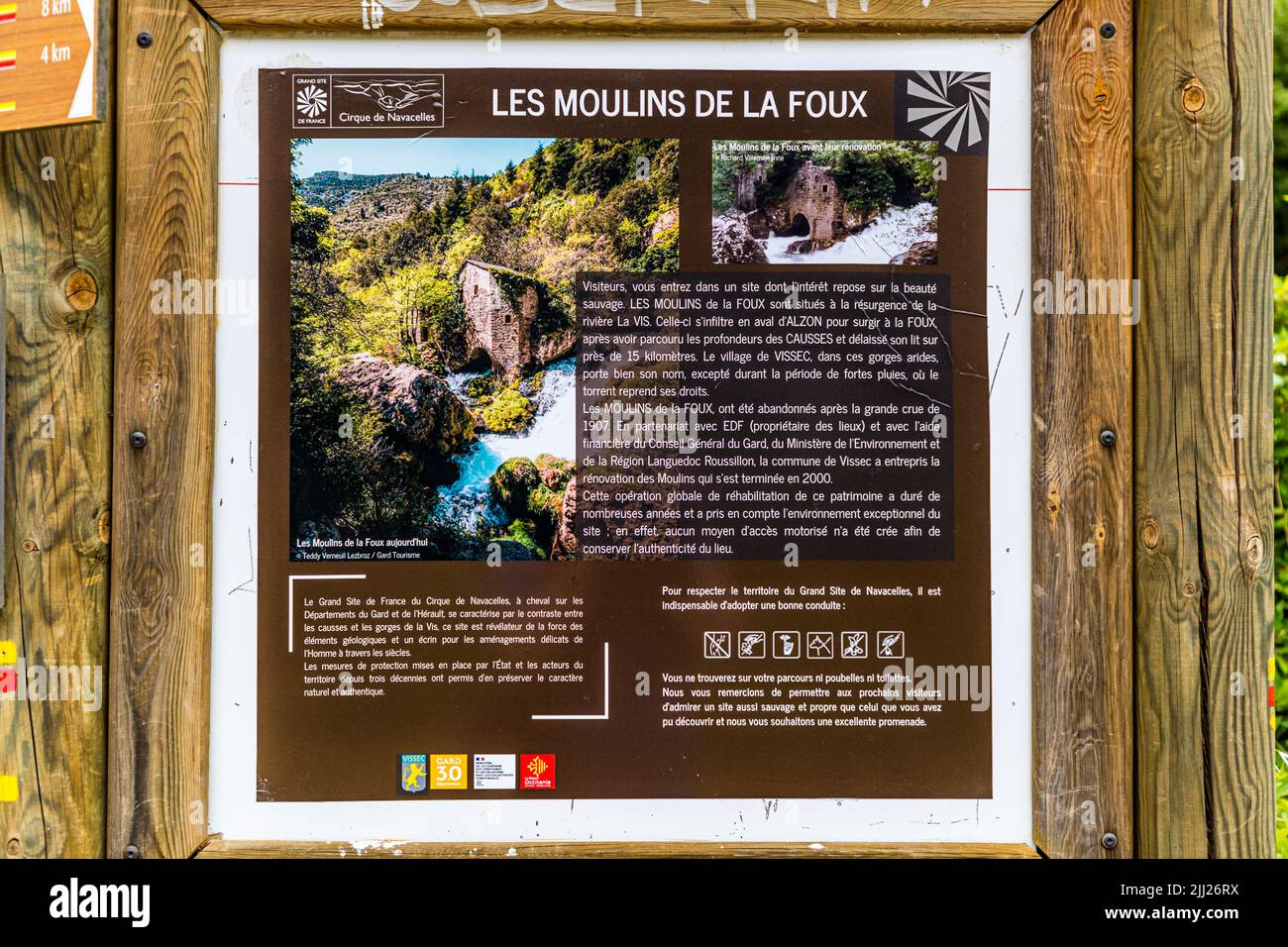 A sign at the starting point of the hike asks for understanding that there are neither trash cans nor toilets at the authentically restored Moulins de la Foux, France Stock Photo