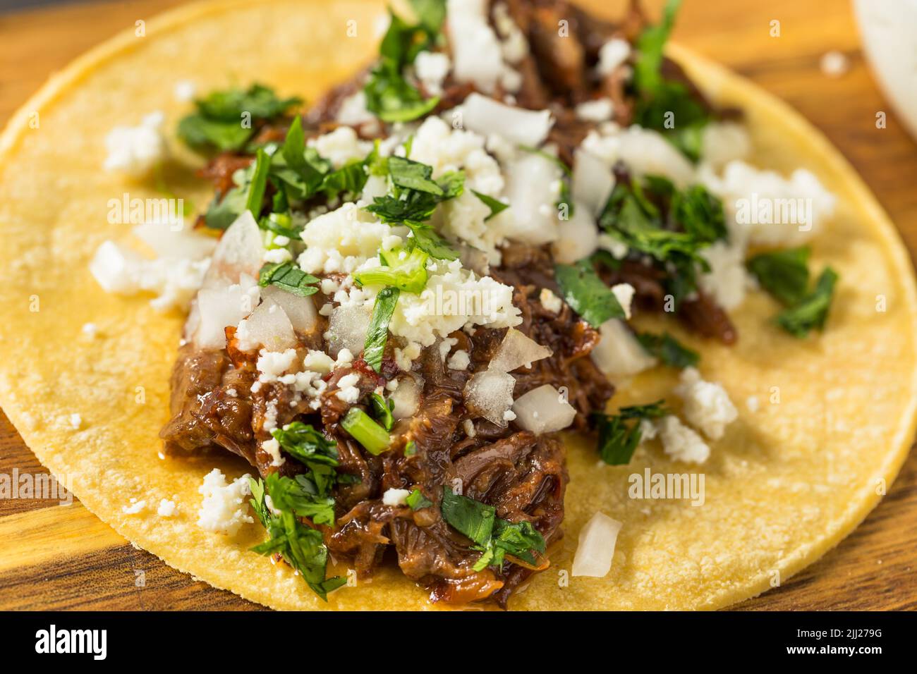 Homemade Mexican Shredded Beef Tacos with Onion and Cheese Stock Photo