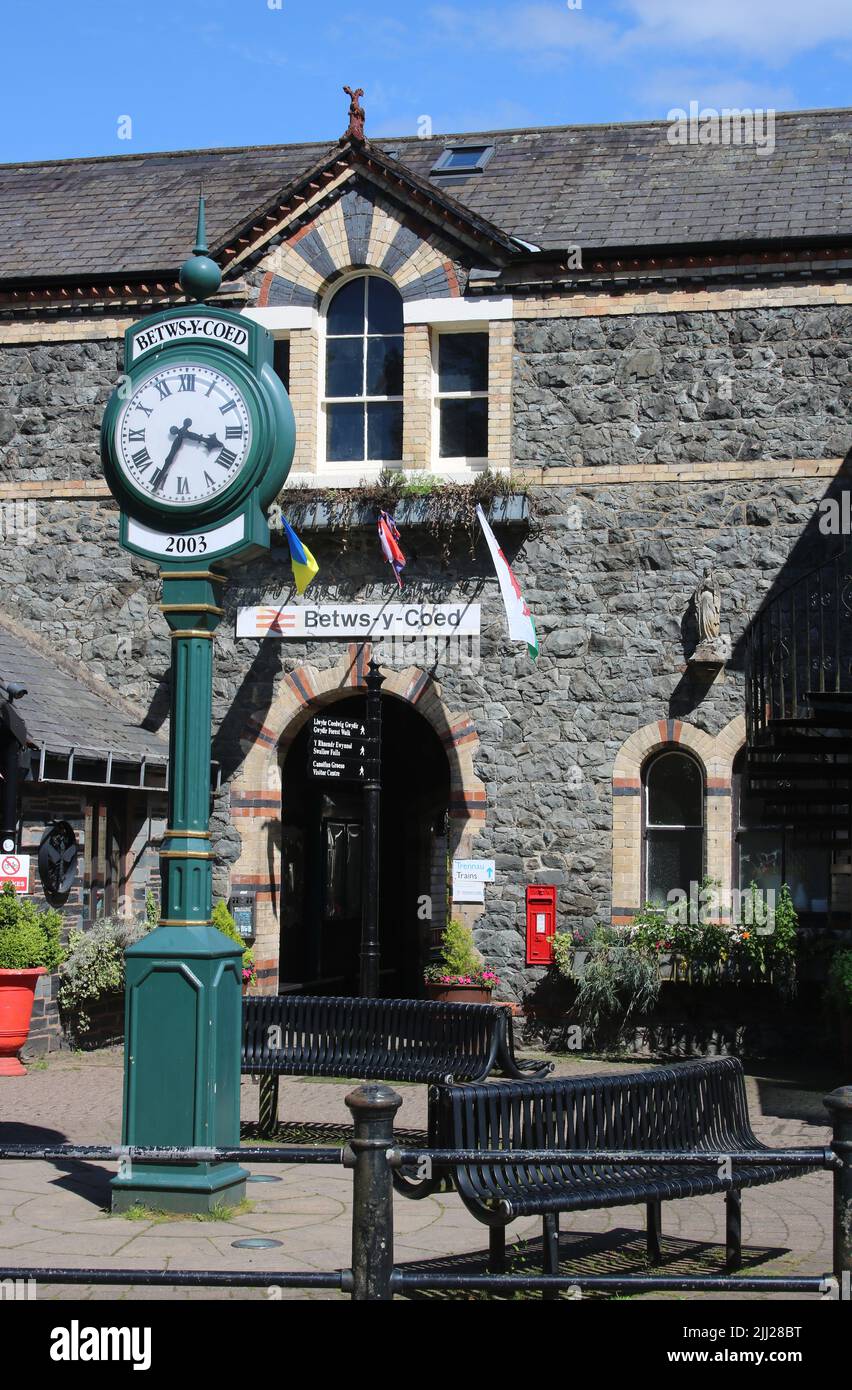 View of the clock outside the entrance to Betws-y-Coed railway station in North Wales, June 2022. Stock Photo
