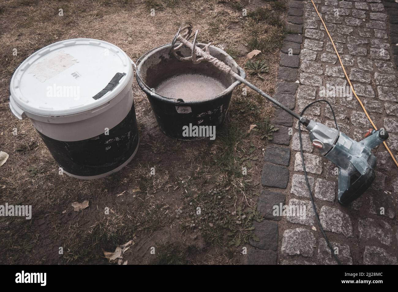 Mixing cement in a bucket hires stock photography and images Alamy
