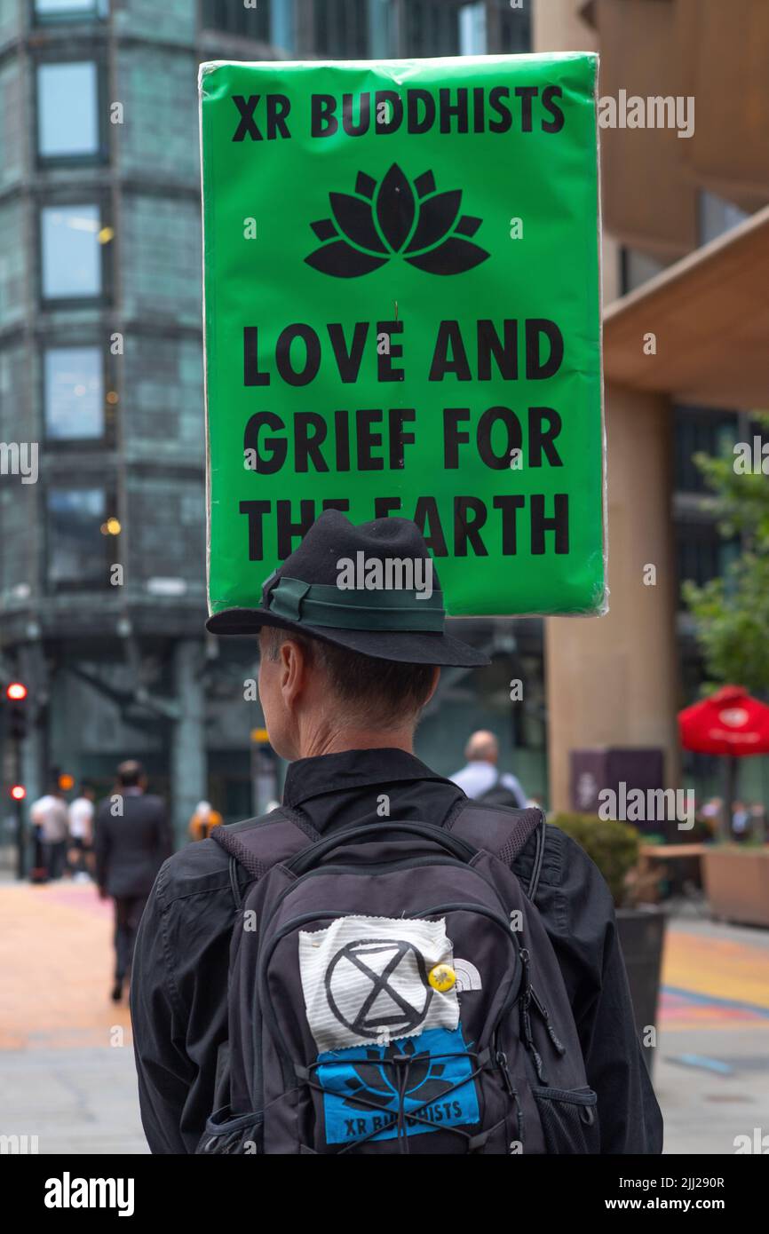 London, England, UK 22/07/2022 Members of Extinction Rebellion Buddhists hold a silent walk to Vanguard Asset management company where they sit in meditative silence s part of an ongoing series of actions against the company Stock Photo