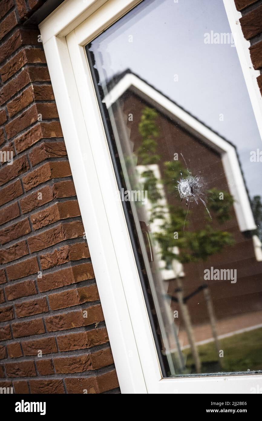 2022-07-22 17:03:58 OSS - A bullet hole in a window on the Veekraal before a shooting took place. For the fourth time in a row, a house in a residential area in Oss has been shot at. The police suspect that there is a relationship between the houses that were shot at and the people who live there. ANP ROB ENGELAAR netherlands out - belgium out Stock Photo