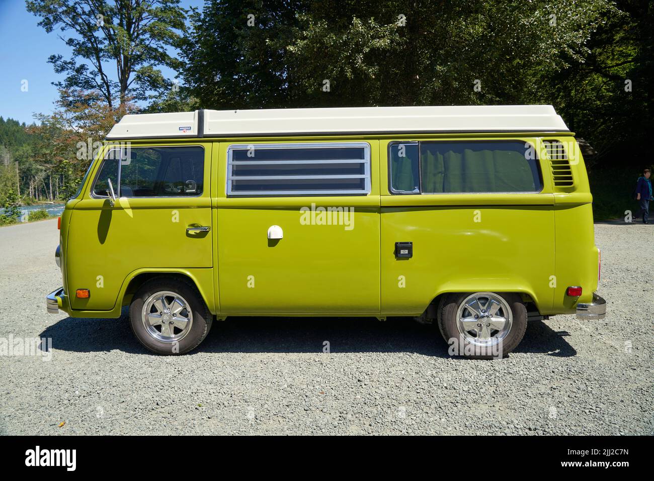 VW vintage van, lime green exterior, parked near Elwha River, Olympic National Park, Port Angeles, Washington, USA. Stock Photo