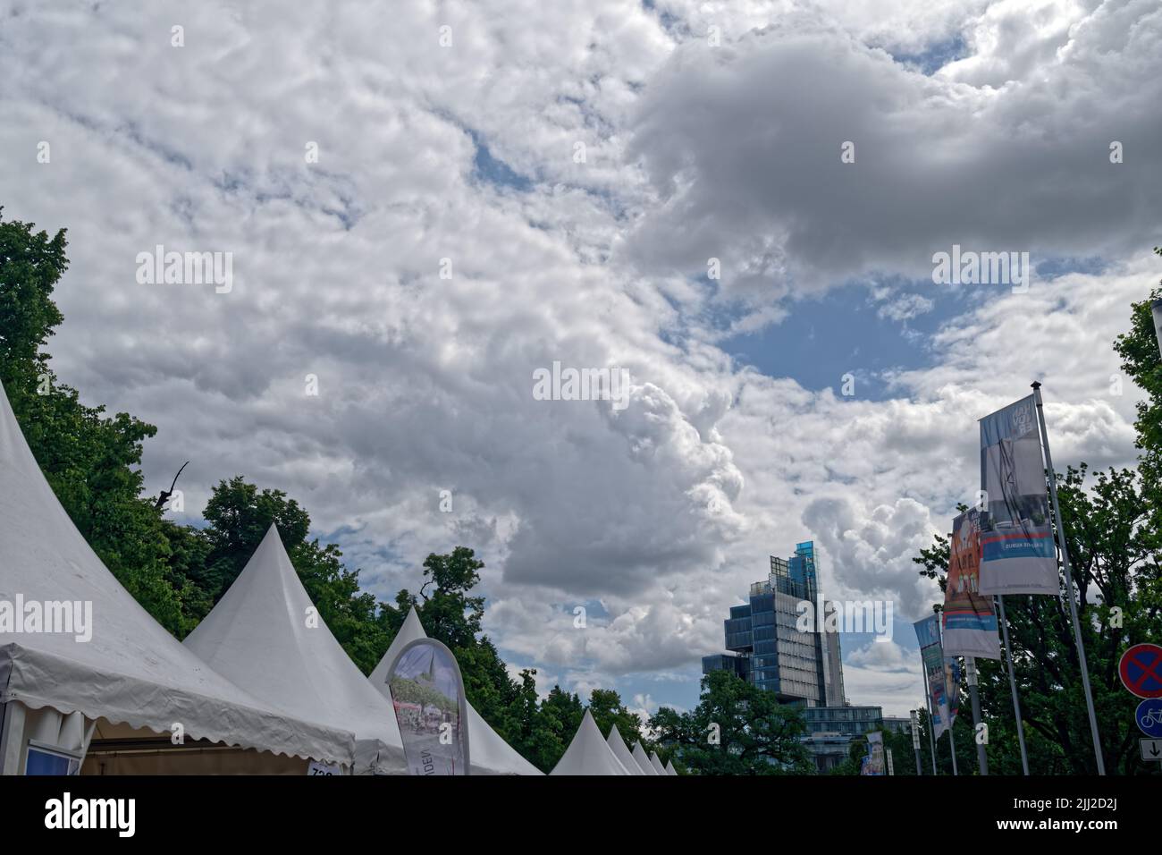 A high-rise office building under a thickly clouded sky in Hanover. Stock Photo
