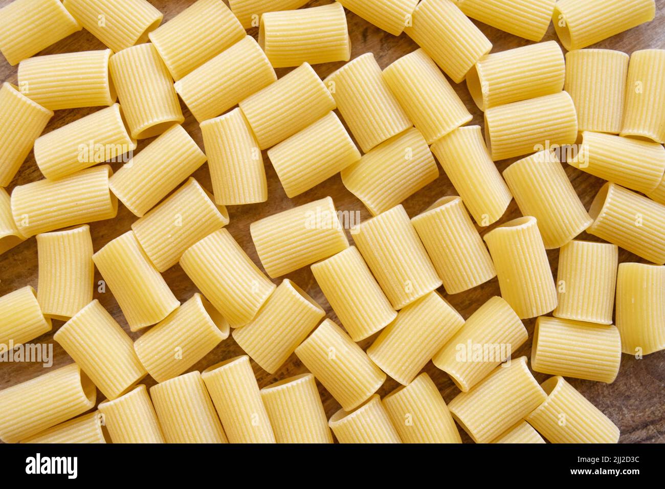 top view of rigatoni pasta on a wooden table Stock Photo