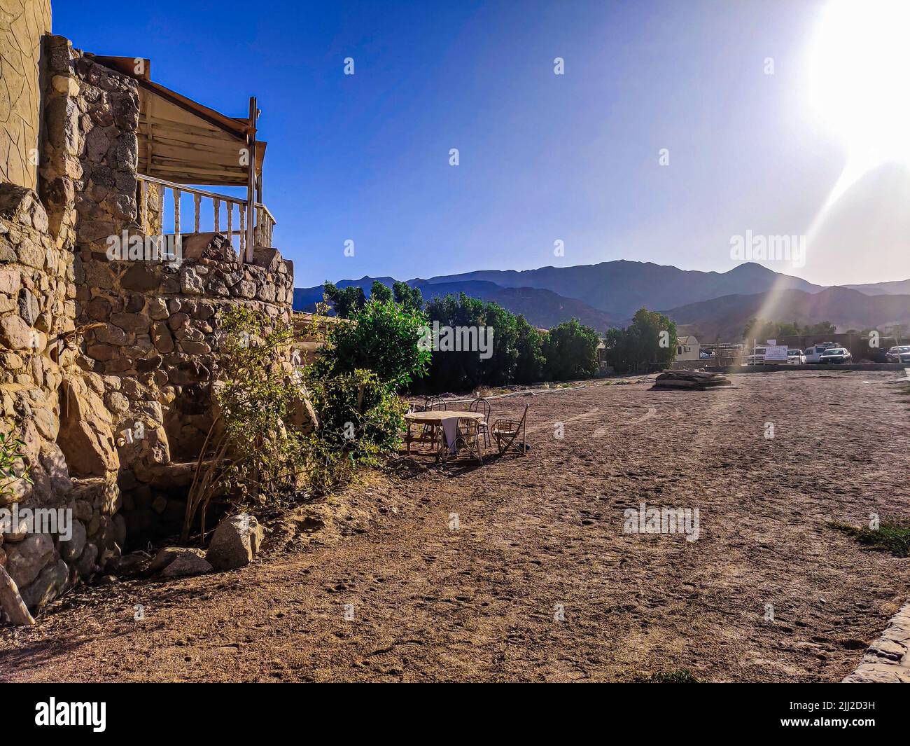 Cottage in a Bedouin Camp on the Sea in Ras Shitan in Oasis in Sinai, Taba desert with the Background of the Sea and Mountains. Stock Photo