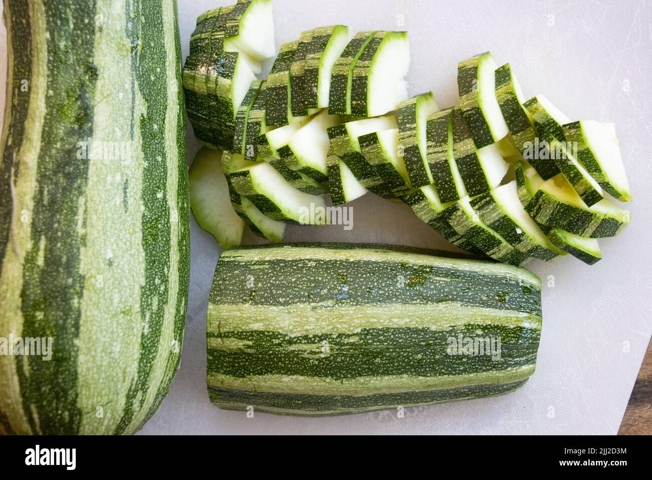 zucchini cut in pieces as ingredient for soup Stock Photo