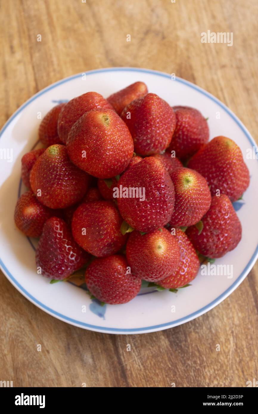 pile of fresh strawberries arranged in a pyramid Stock Photo