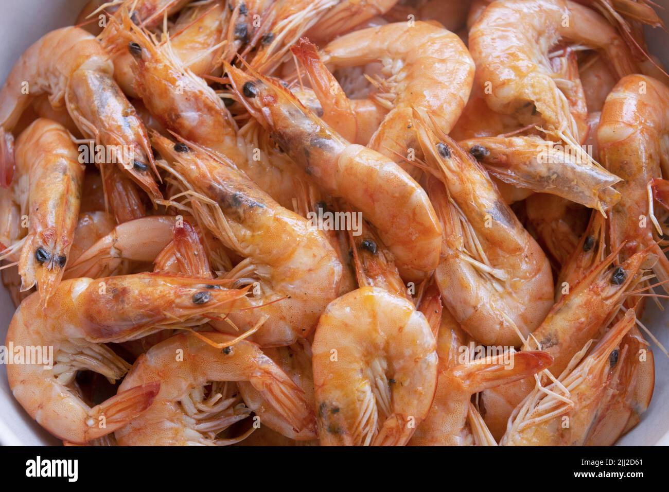 flat lay of fried shrimps in a ceramic bowl Stock Photo