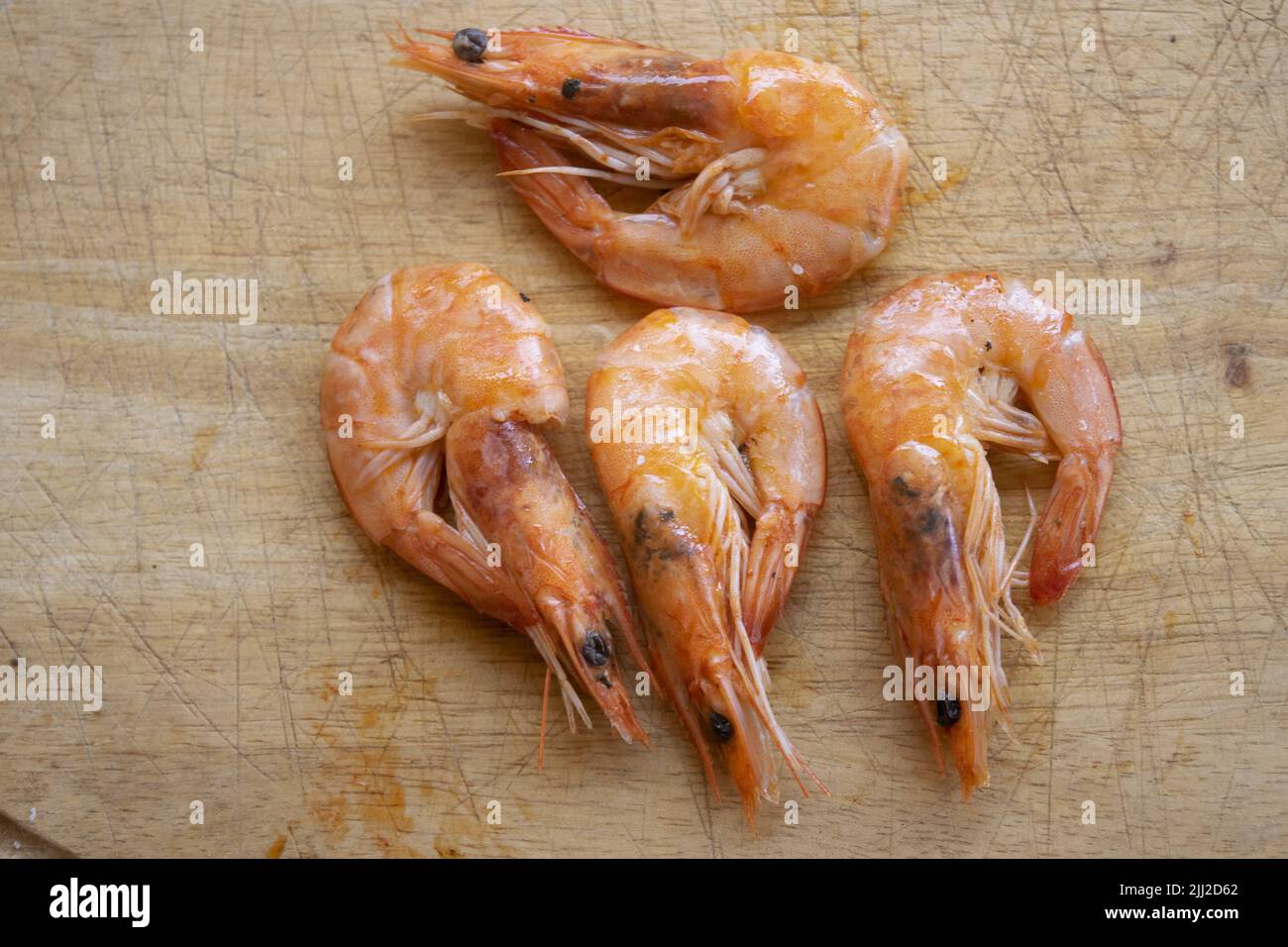 cooked fried shrimps on a wooden bacground Stock Photo