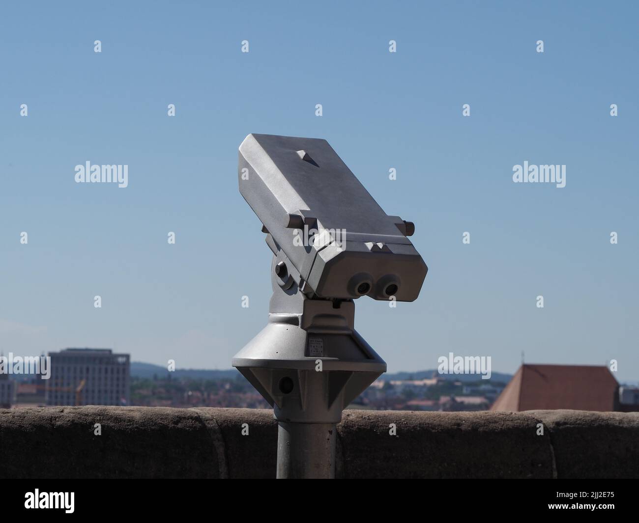 binocular at viewing platform in elevated place over the city centre