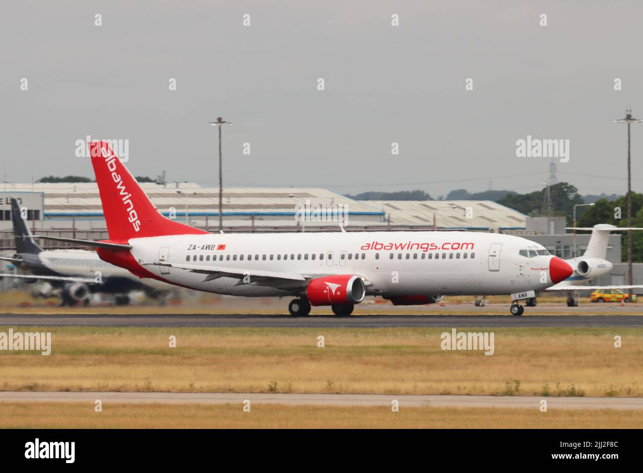 Albawings, Boeing 737 ZA-AWB, departing Stansted Airport, Essex, UK Stock Photo