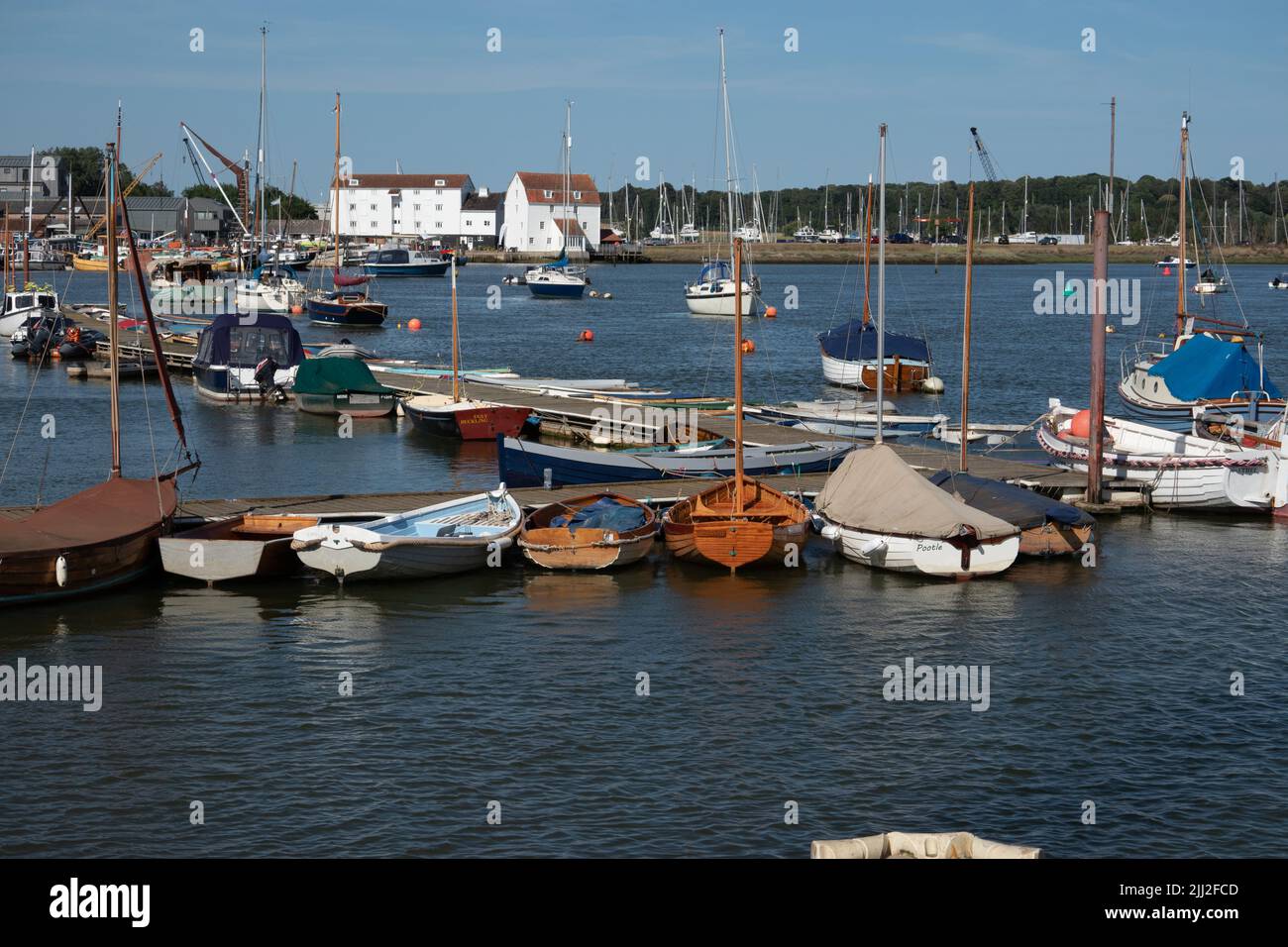 Boats moored at Woodbridge harbour near the Tidemill Suffolk England