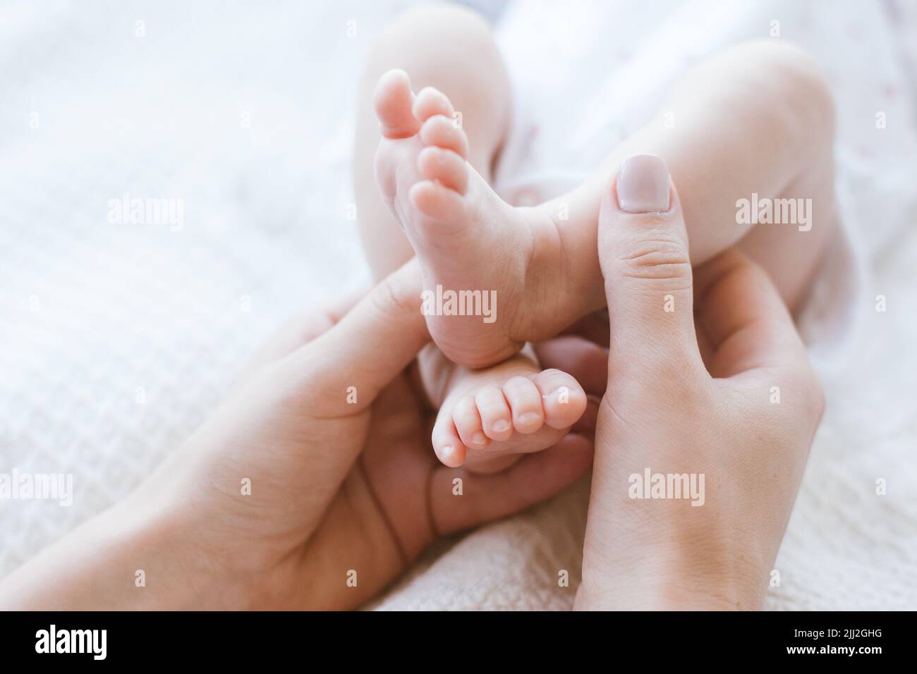 mother foot massage newborn baby Stock Photo Alamy