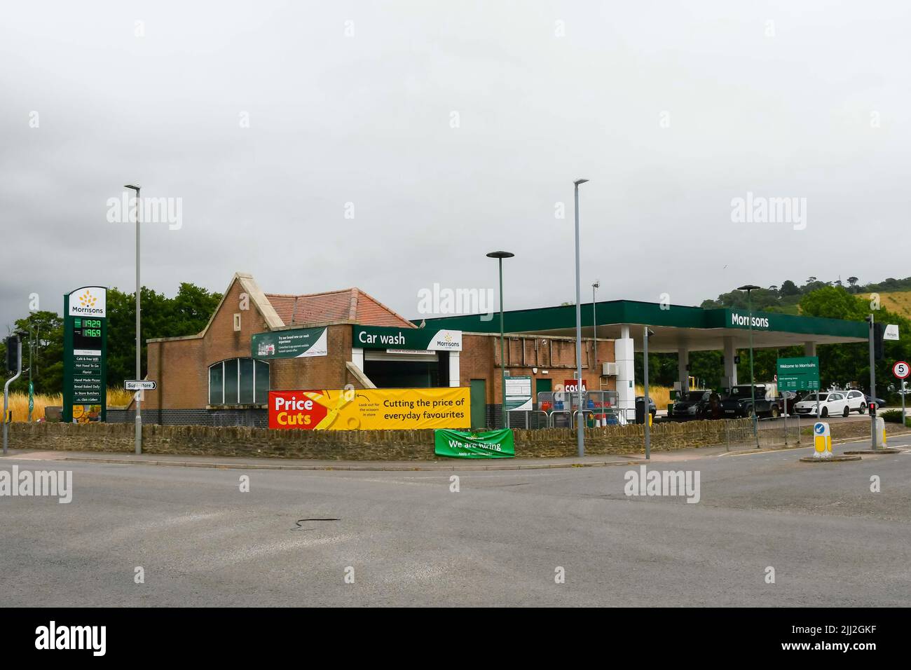 Bridport, Dorset, UK. 22nd July 2022. Customers at the Morrisons Petrol