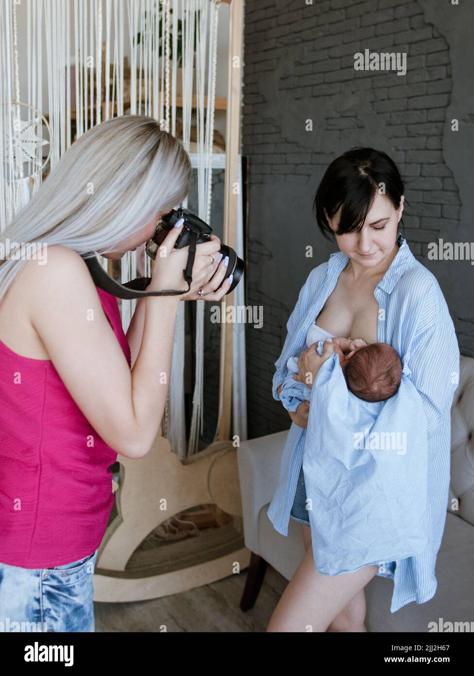 newborn baby mother photoshoot backstage Stock Photo