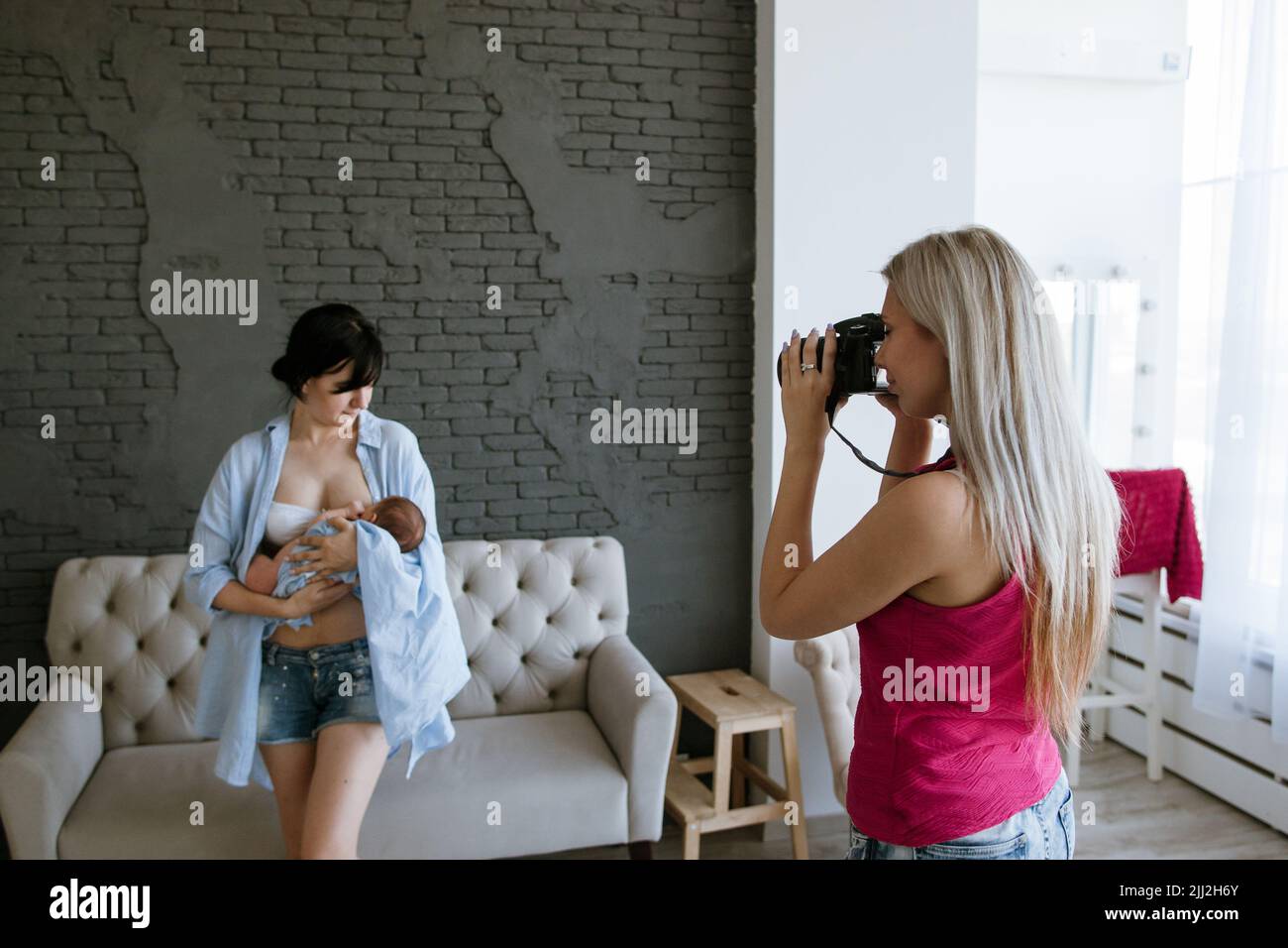 newborn baby mother photoshoot backstage Stock Photo