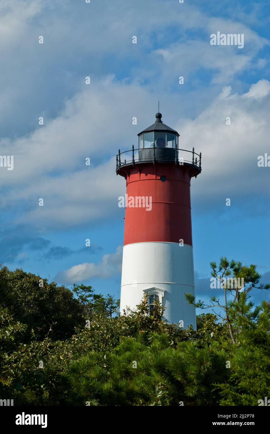 Nauset Lighthouse tower among puffy clouds on a sunny summer day on Cape Cod, in Massachusetts. Stock Photo