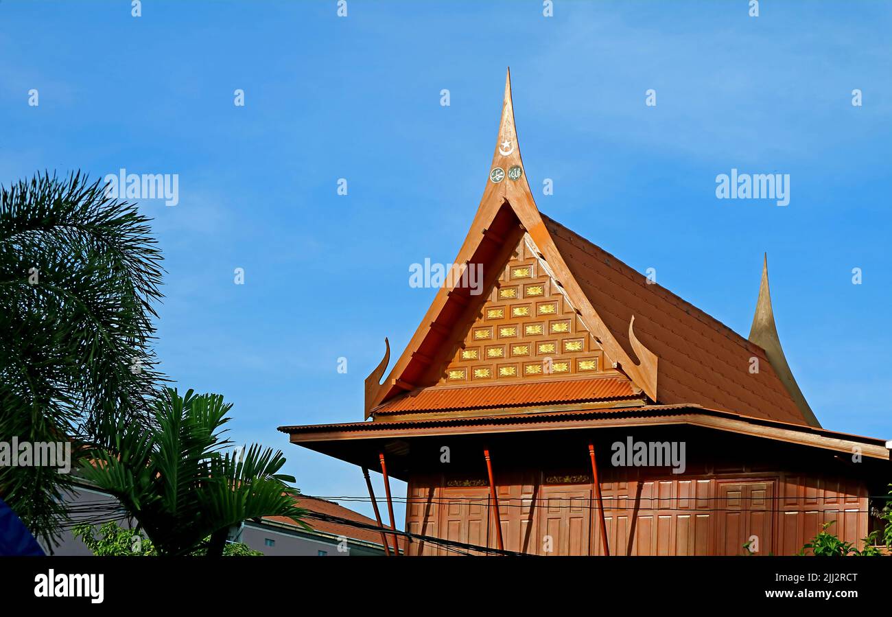 Ornate Gable Roof of Thai Traditional Wooden House with Islamic Art Motif Stock Photo