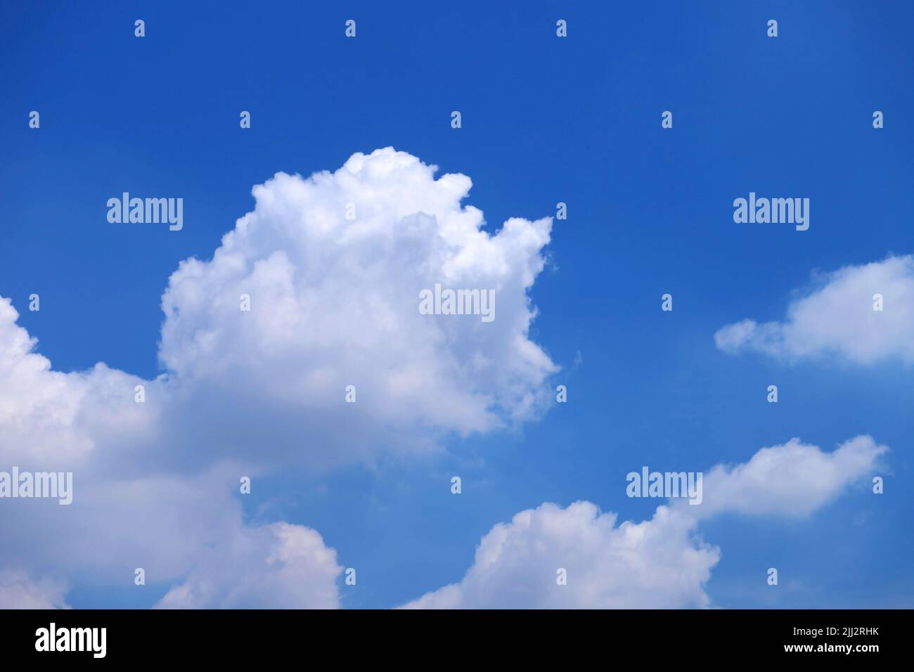 Fluffy Cumulus Clouds Floating on Vivid Blue Sunny Sky Stock Photo - Alamy