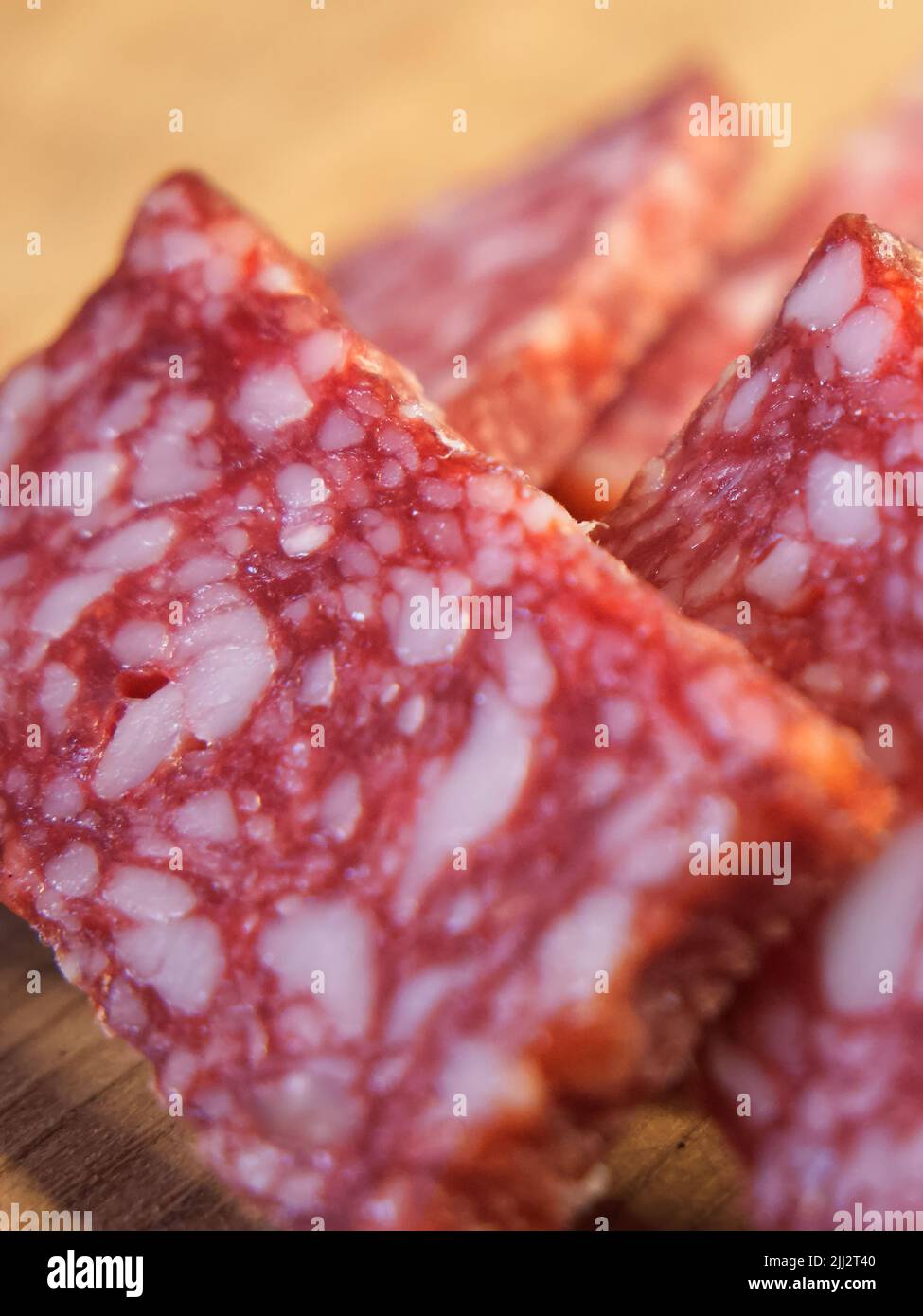 Pieces of salami sausage, closeup. Delicious meat appetizer Stock Photo Alamy