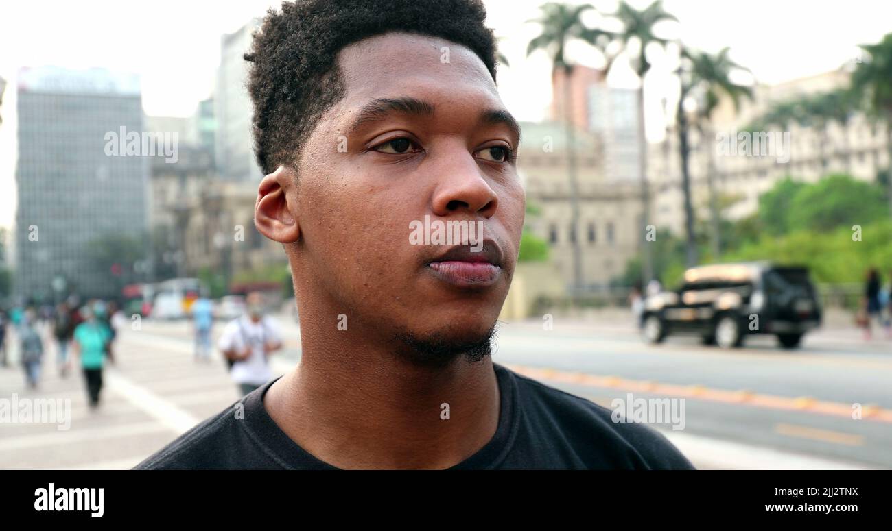 Pensive man walking downtown hi-res stock photography and images - Alamy