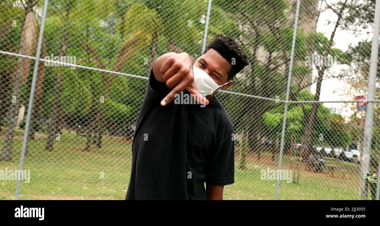 Black African man performing urban dance wearing covid face mask Stock ...