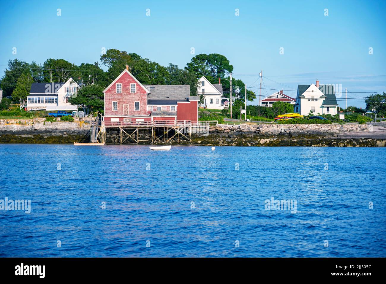 sailboats anchored in a bay of Maine coast fishing port, Bailey Island Stock Photo