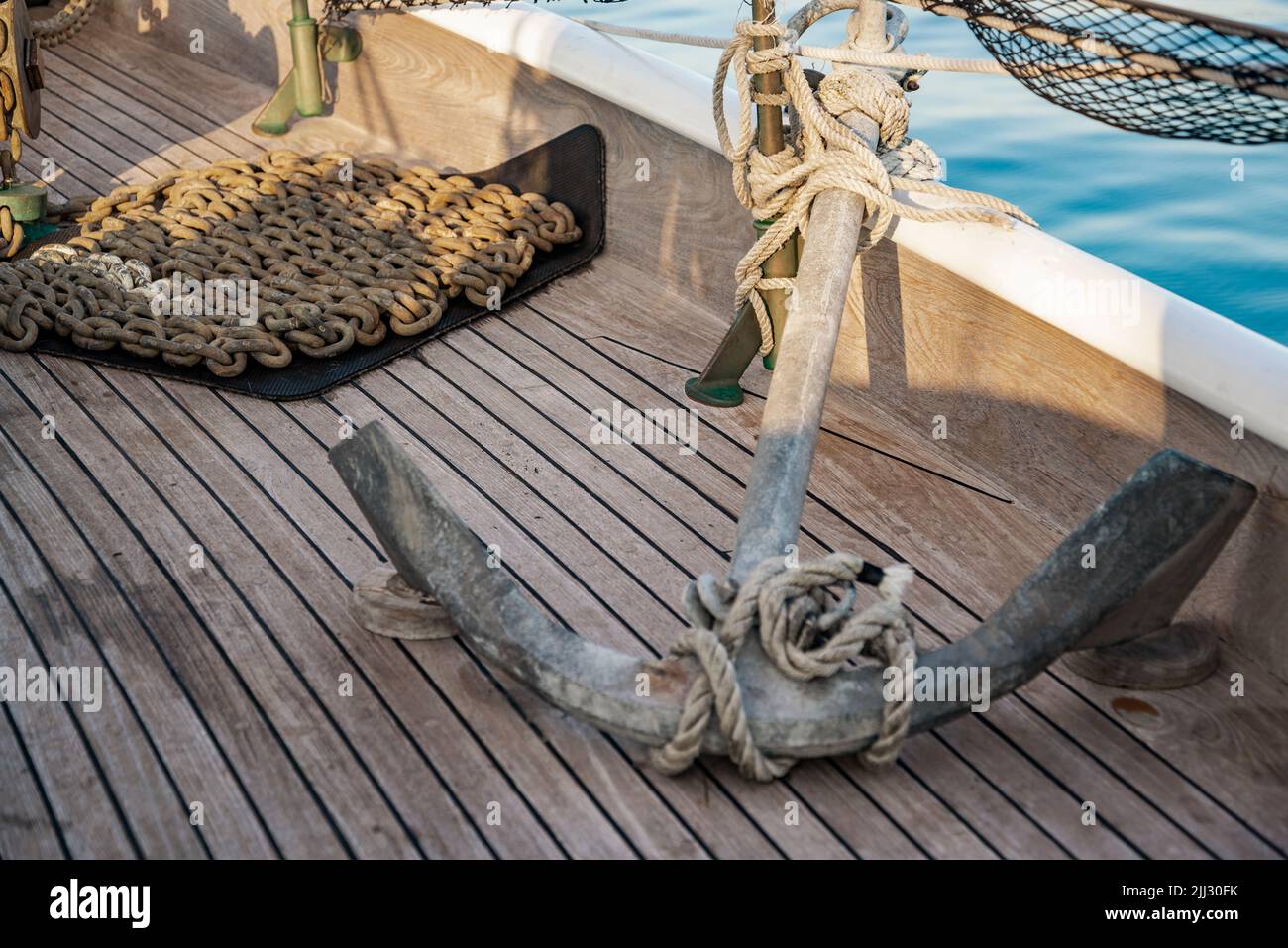 Anchor on wood background on an old vessel, America Stock Photo