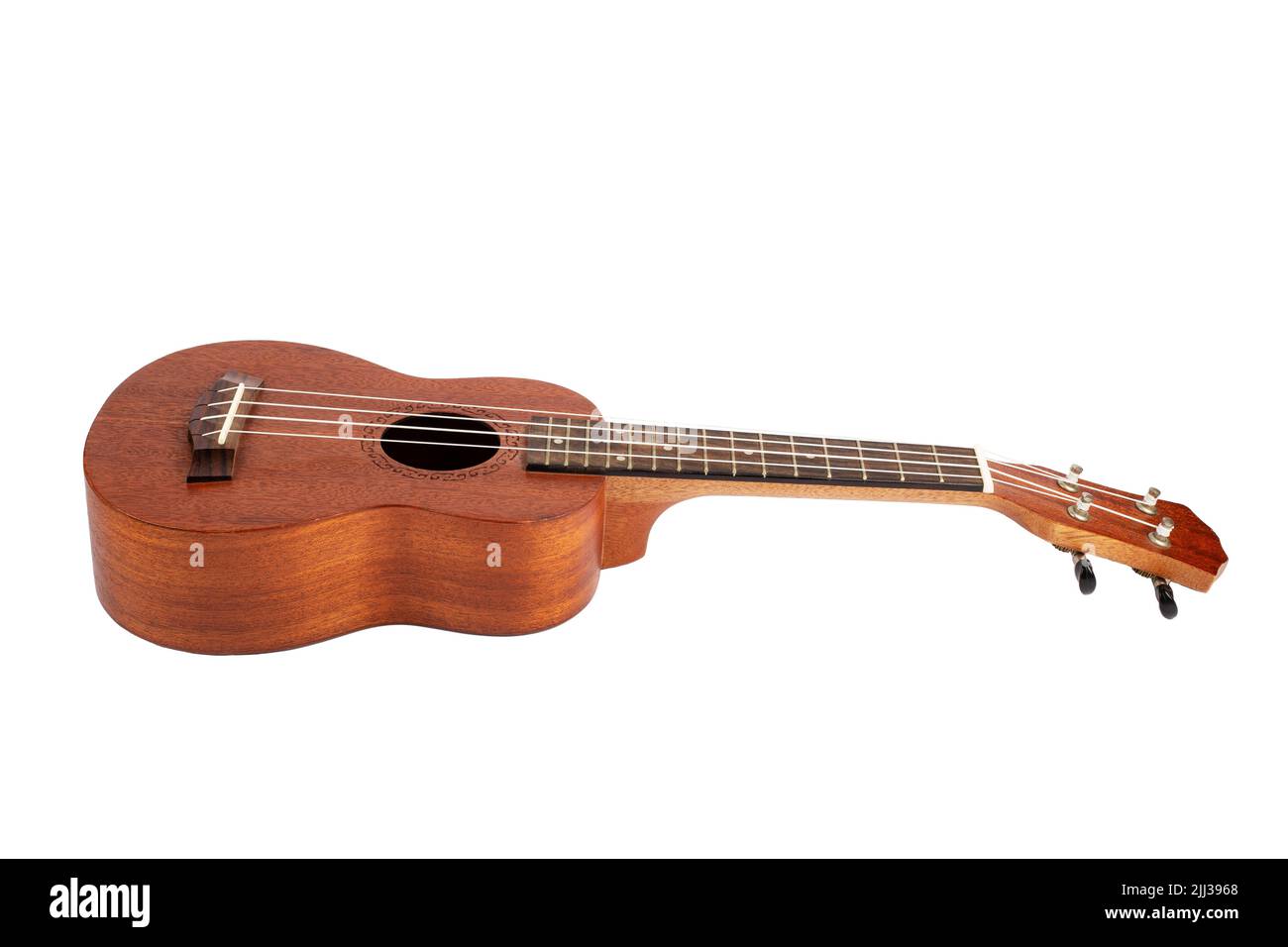Wooden ukulele guitar isolated over white background Stock Photo