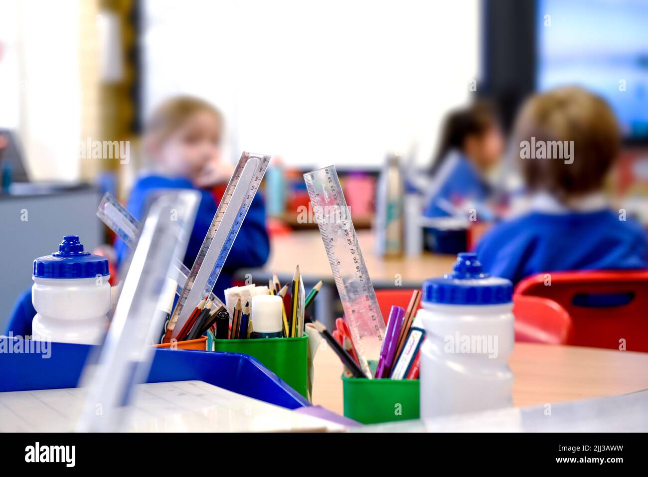 School classroom scene with kids learning in background Stock Photo