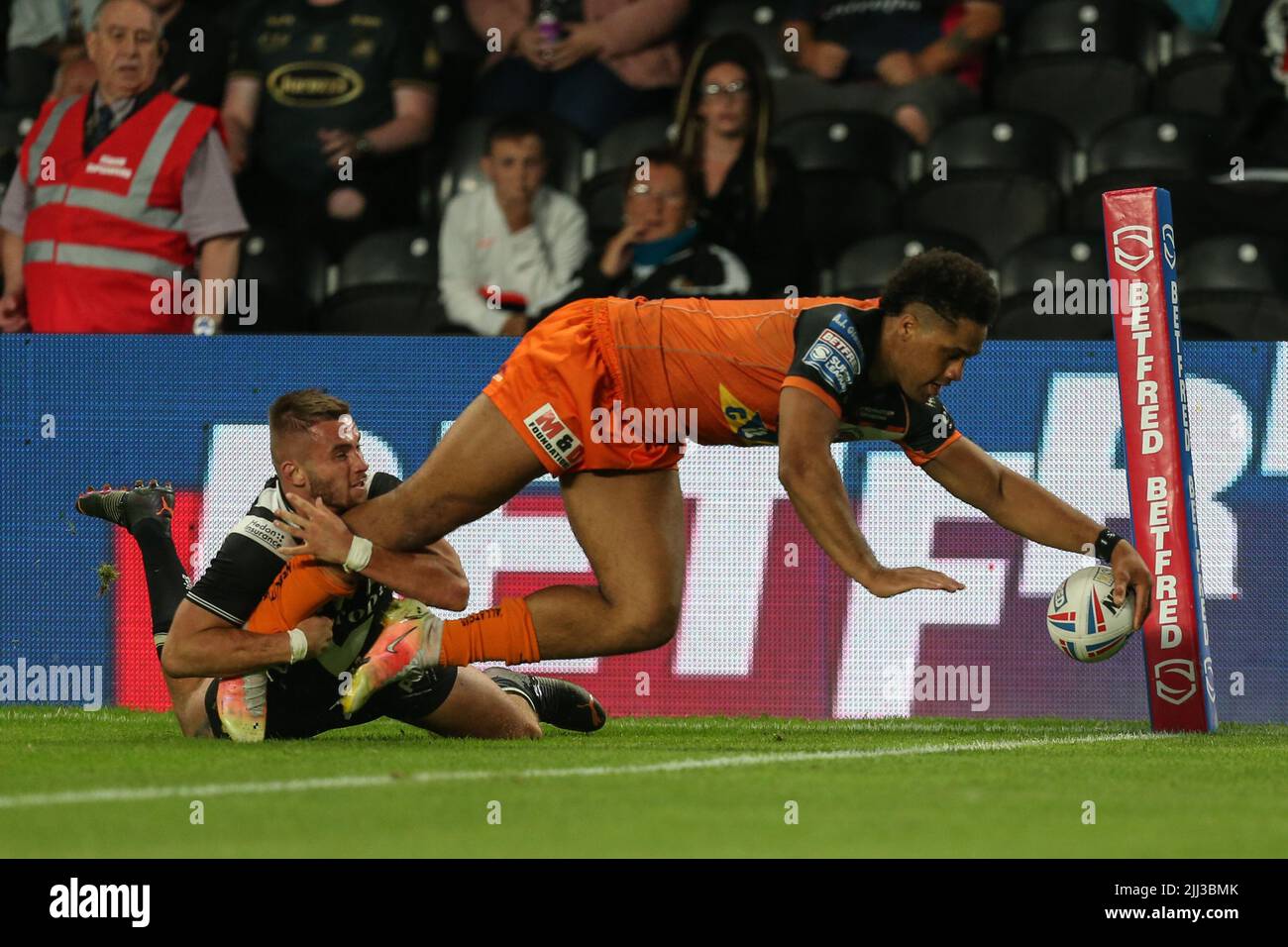 Derrell Olpherts #2 of Castleford Tigers runs to the try line to complete his hat-trick of tries Stock Photo