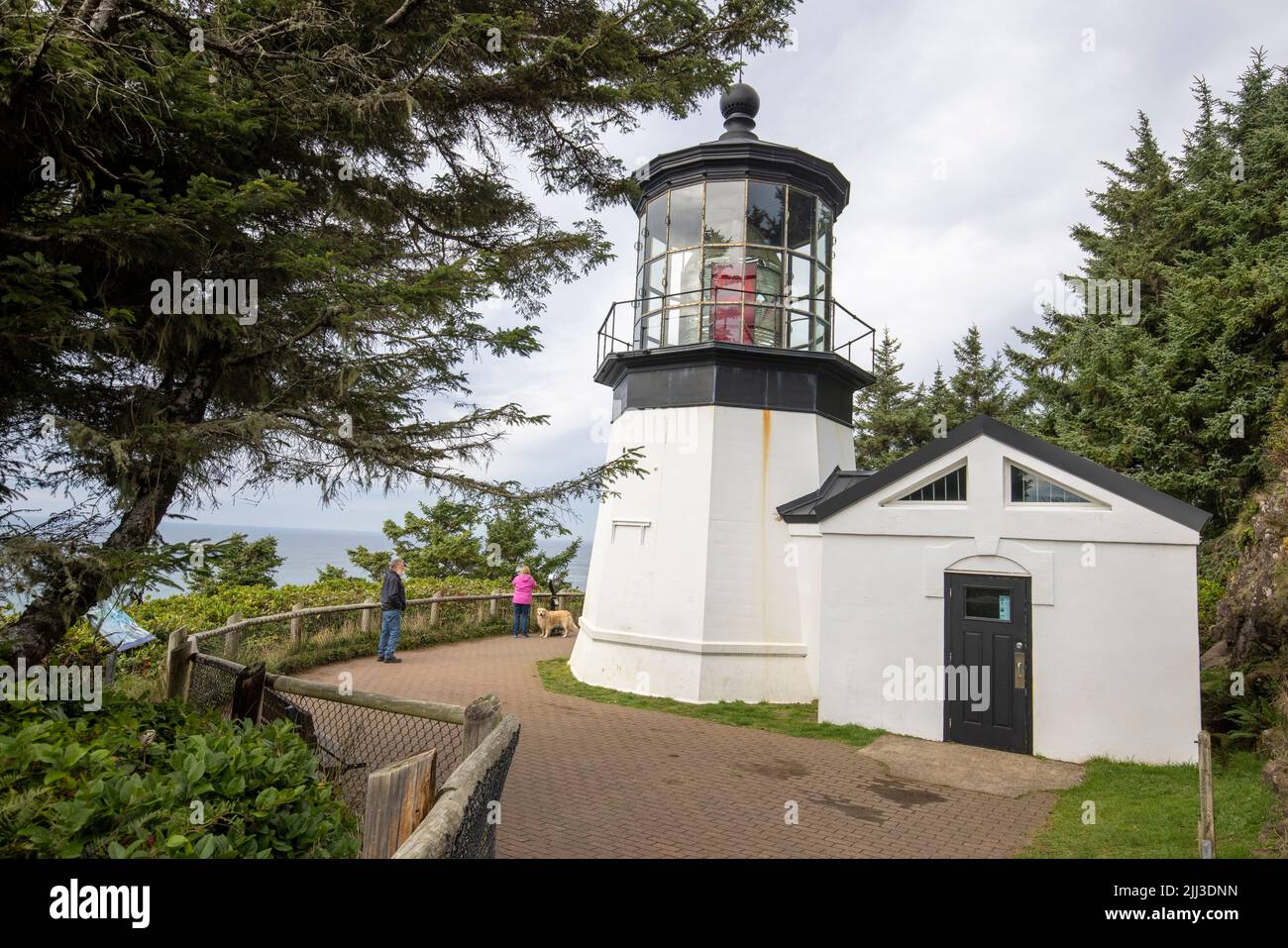 The Cape Meares Lighthouse is a lighthouse on the coast of Oregon. It is located on Cape Meares just south of Tillamook Bay. Stock Photo